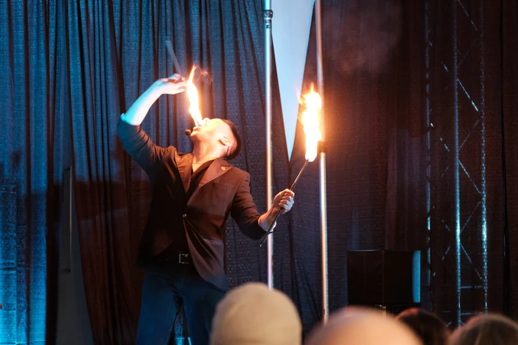 Magician Neil Fama performing a card flourish